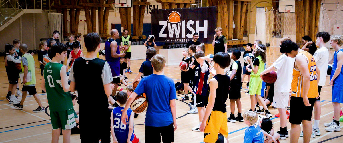 Kids at a ZWISH basketball camp in Copenhagen under the ZWISH banner